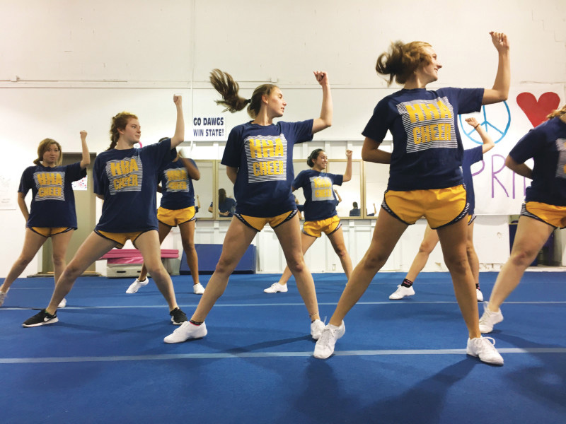 Photo by ALLISON THOMEY
A SHOUT OUT: Cheerleaders, from left, senior Sydney Middlebrook, senior Bailey Norton, junior Emma Fay Crider, freshman Anh Cao and junior Emma Kate Henry, practice at Pride of NWA.
