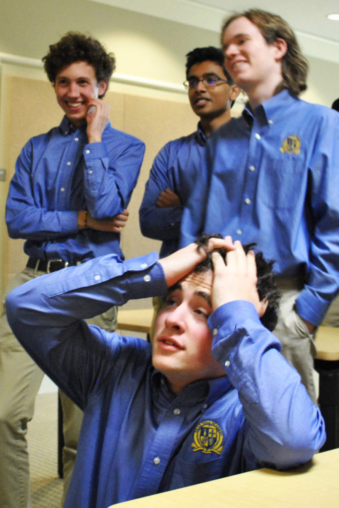 Photo by BENJAMIN BATCHELOR
Senior Sam Lipson, front, reacts as his teammates, including, from left, juniors Aubin Payne and Sai Sirigineedi and senior Connor Fritsch, discuss their close win following their televised win at the Senior High Quiz Bowl state championship in Conway on April 22, 2017.